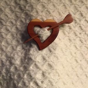 Heart wood scarf holder.